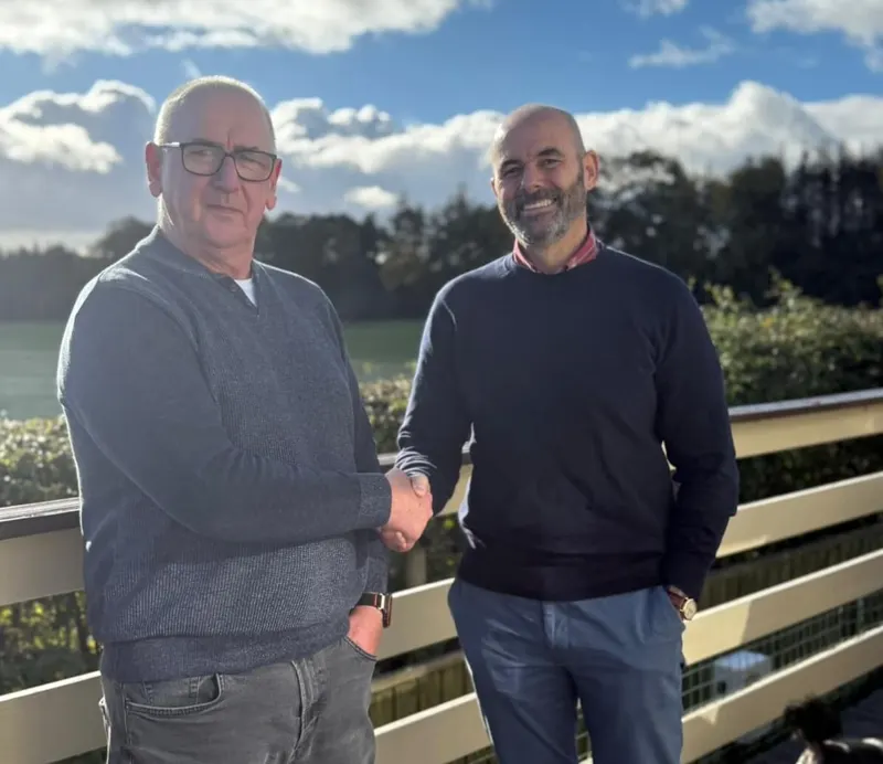 Derek Allan shaking hands after selling his house fast